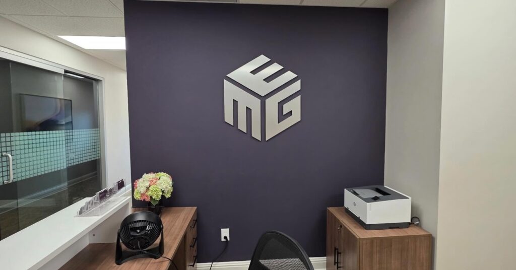 Equity Management Group interior dimensional logo sign installed in Lexington, Kentucky office Title