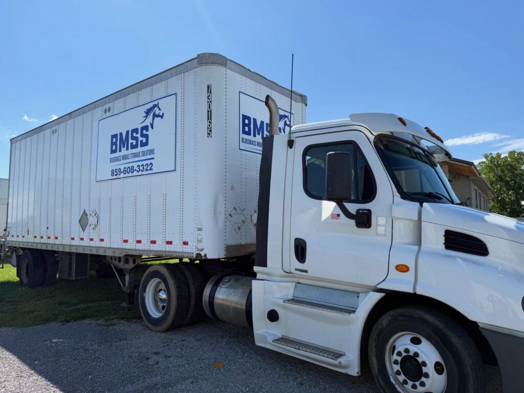 Branded commercial box truck with custom graphics.