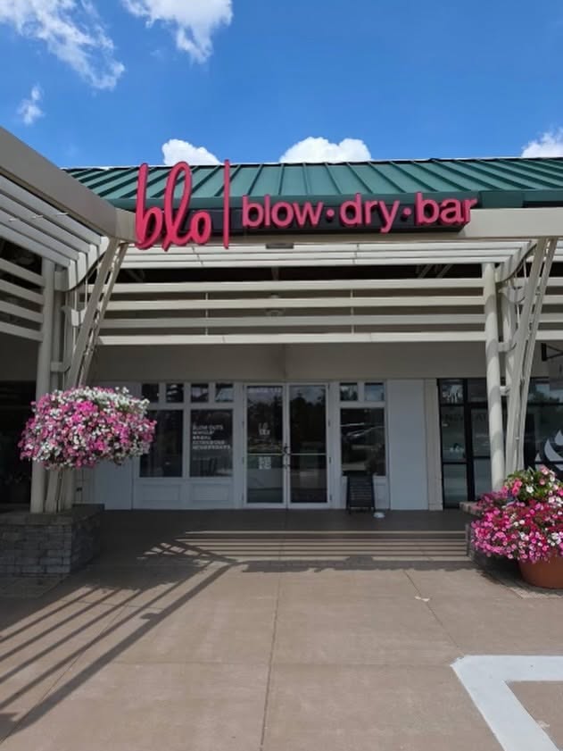 Custom hanging storefront sign for Blo Blow Dry Bar installed by The Sign Shop in Lexington, Kentucky.
