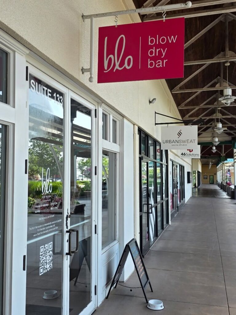 Outdoor hanging sign installed for Blo Blow Dry Bar at Lexington Green in Lexington KY.