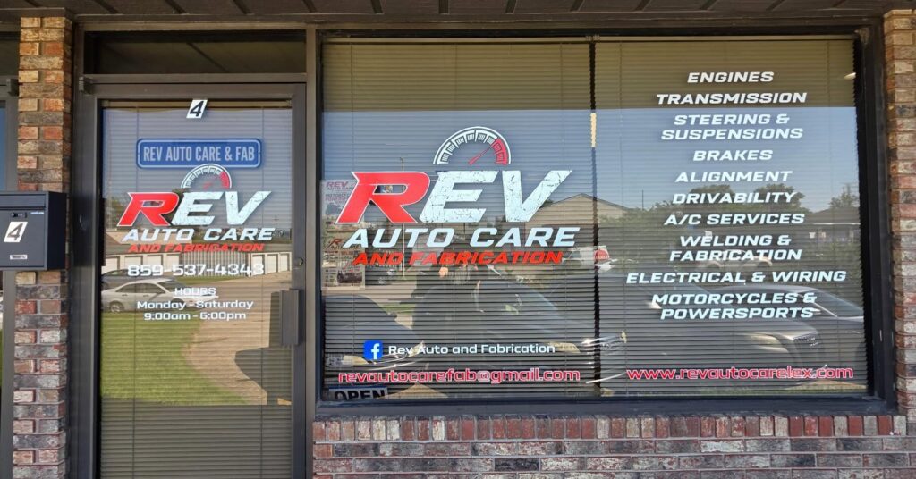 Custom storefront window graphics installed for REV Auto Care in Lexington, Kentucky.