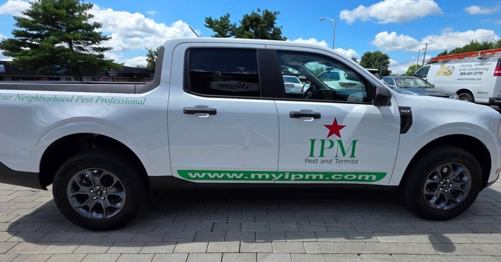 Passenger-side vinyl truck graphics for IPM Pest and Termite in Lexington, KY